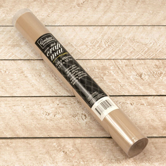 Roll of craft mat in it's packaging on a wooden surface