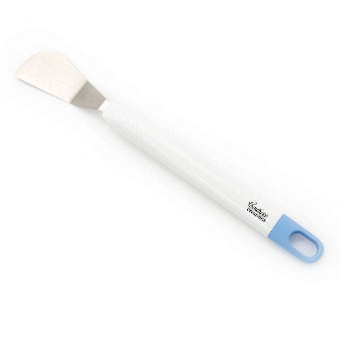 White spatula with blue handle on a white background