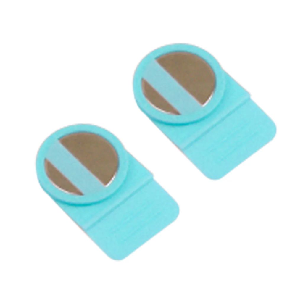 Two turquoise plastic covers over magnets for use with the Precision Stamp Press. 