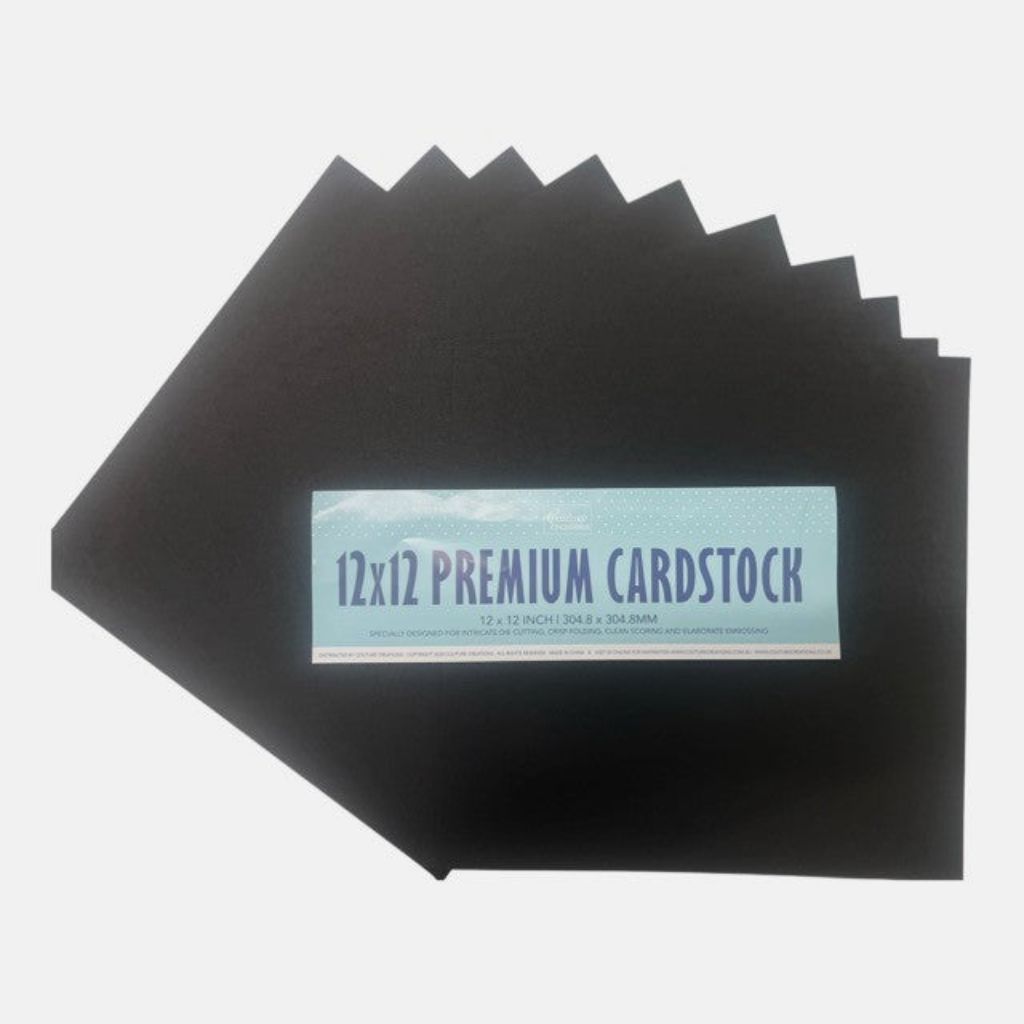 Stack of 12x12 premium black cardstock sheets on a white background