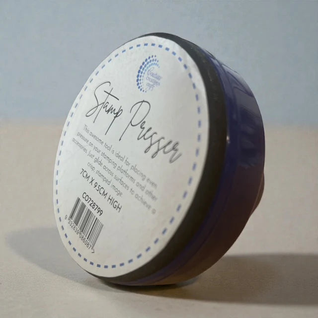 Couture Creations Stamp Pressing Tool packaged with label showing 7cm x 9.5cm dimensions