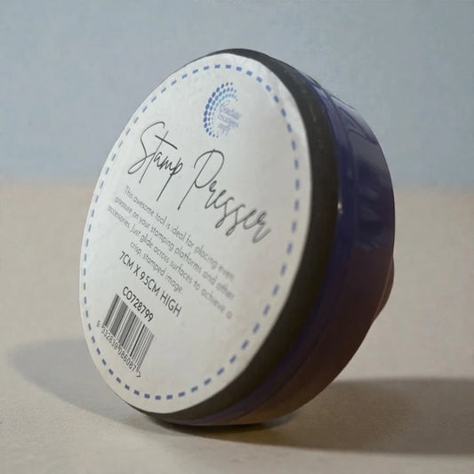 Couture Creations Stamp Pressing Tool packaged with label showing 7cm x 9.5cm dimensions