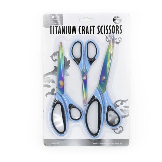 Packaged titanium craft scissors with colourful handles on a white background