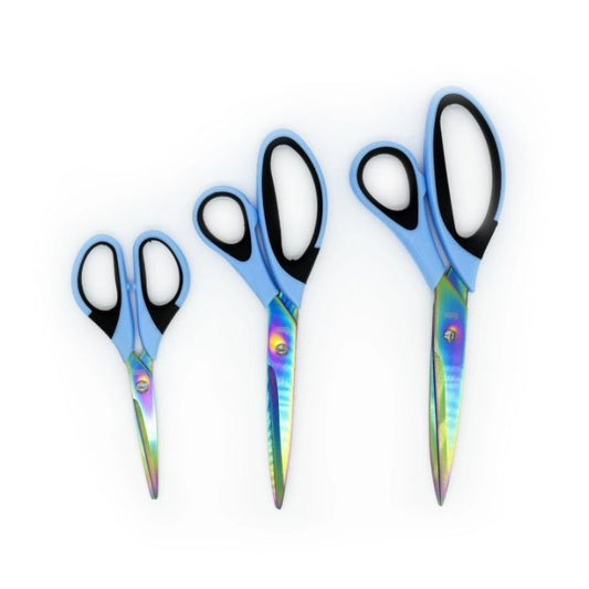 Three pairs of scissors with titanium blades on a white background