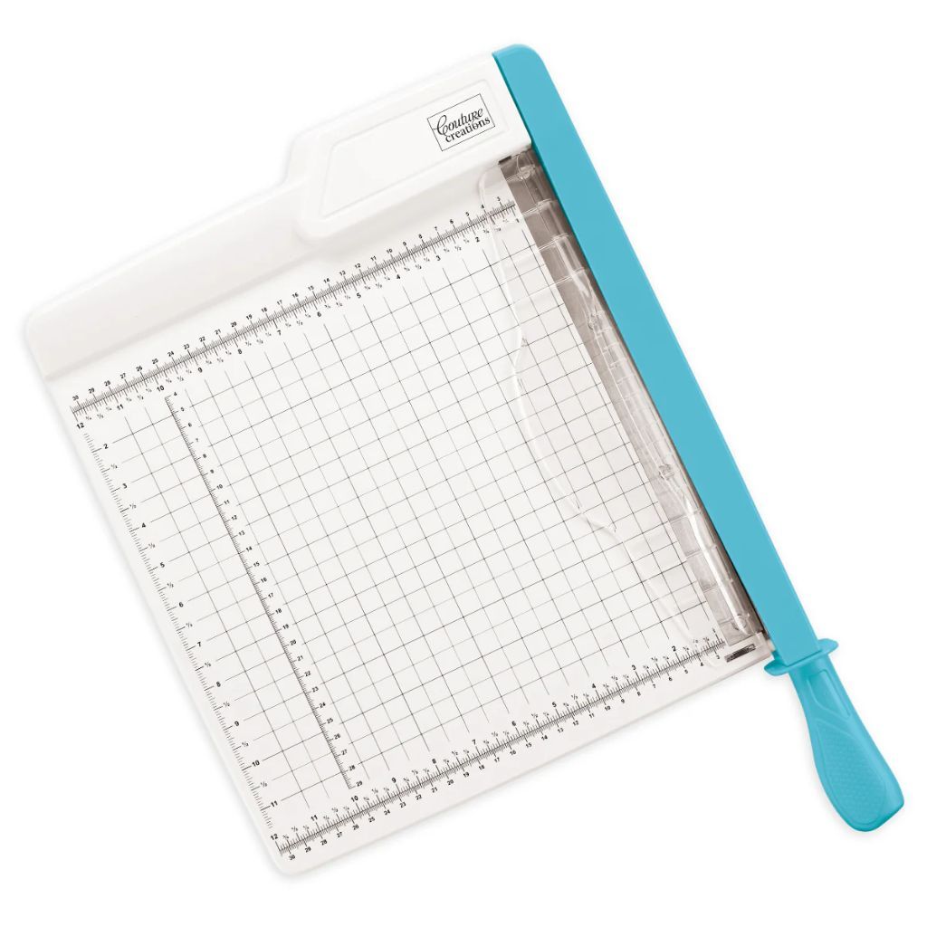 Paper trimmer with grid cutting mat and blue handle on a white background