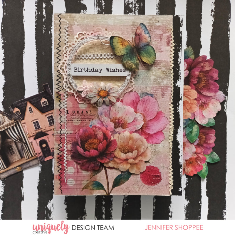 Vintage-style birthday card with Uniquely Creative Dressed in Daydreams collection showing rainbow butterfly, pink watercolour flowers, lace trim, vintage house die-cut and black striped background