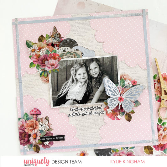 Scrapbook layout using Uniquely Creative Dressed in Daydreams collection with pink polka dot background, watercolour flowers, vintage butterflies, clock ephemera and 'kind of wonderful a little bit of magic' sentiments