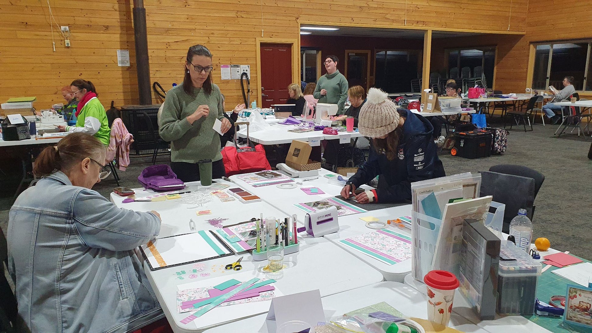 Participants enjoying a scrapbooking class at spacious craft tables during Handmade Craftery Retreat in Yarra Ranges