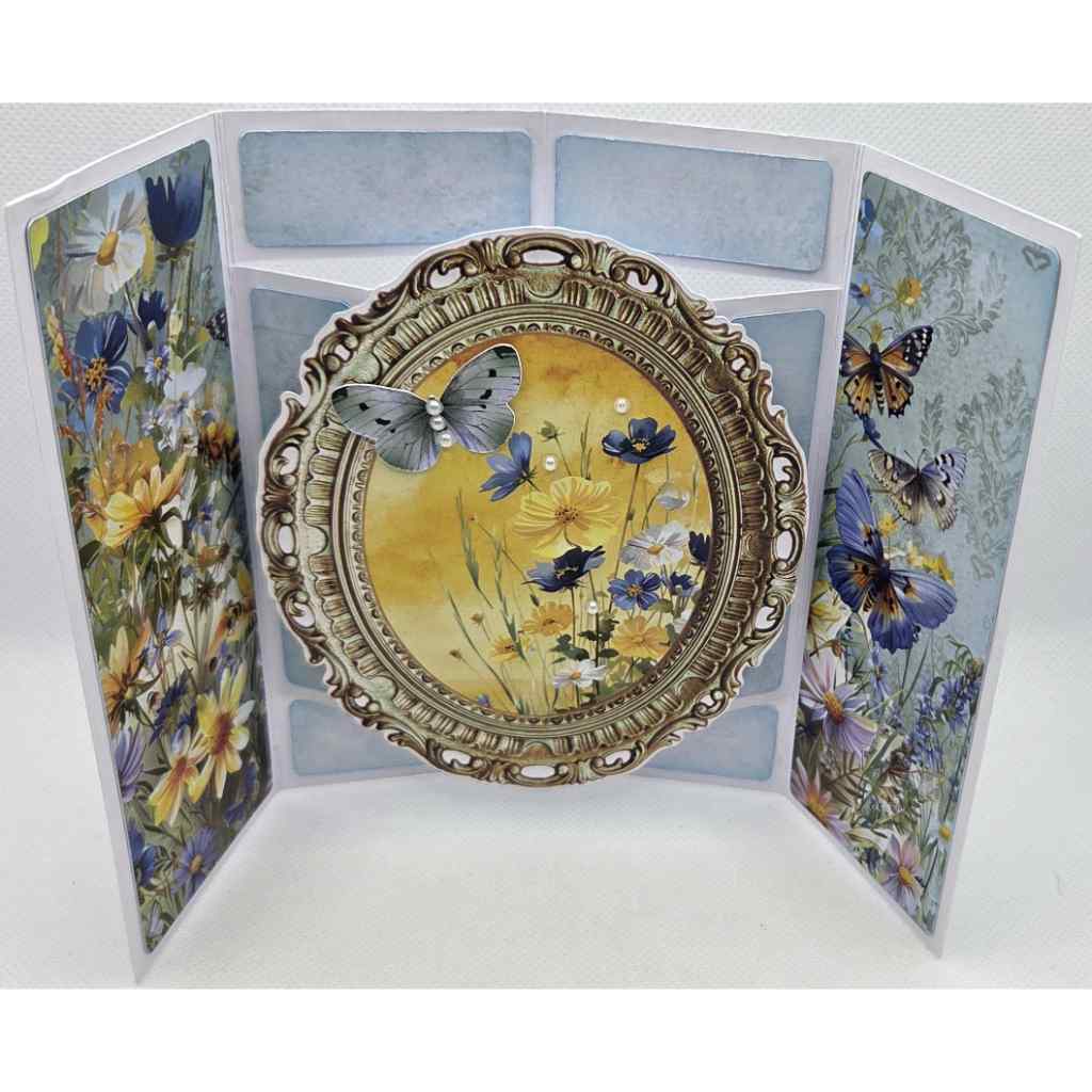 Honey Fields pop-out oval frame card open and displayed, featuring butterfly and wildflower embellishments on Honey Fields patterned papers by 3Quarter Designs