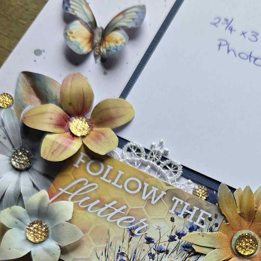 Close-up of left page cluster on Honey Fields scrapbook layout kit featuring flowers, butterfly embellishment and Follow the Flutter title piece