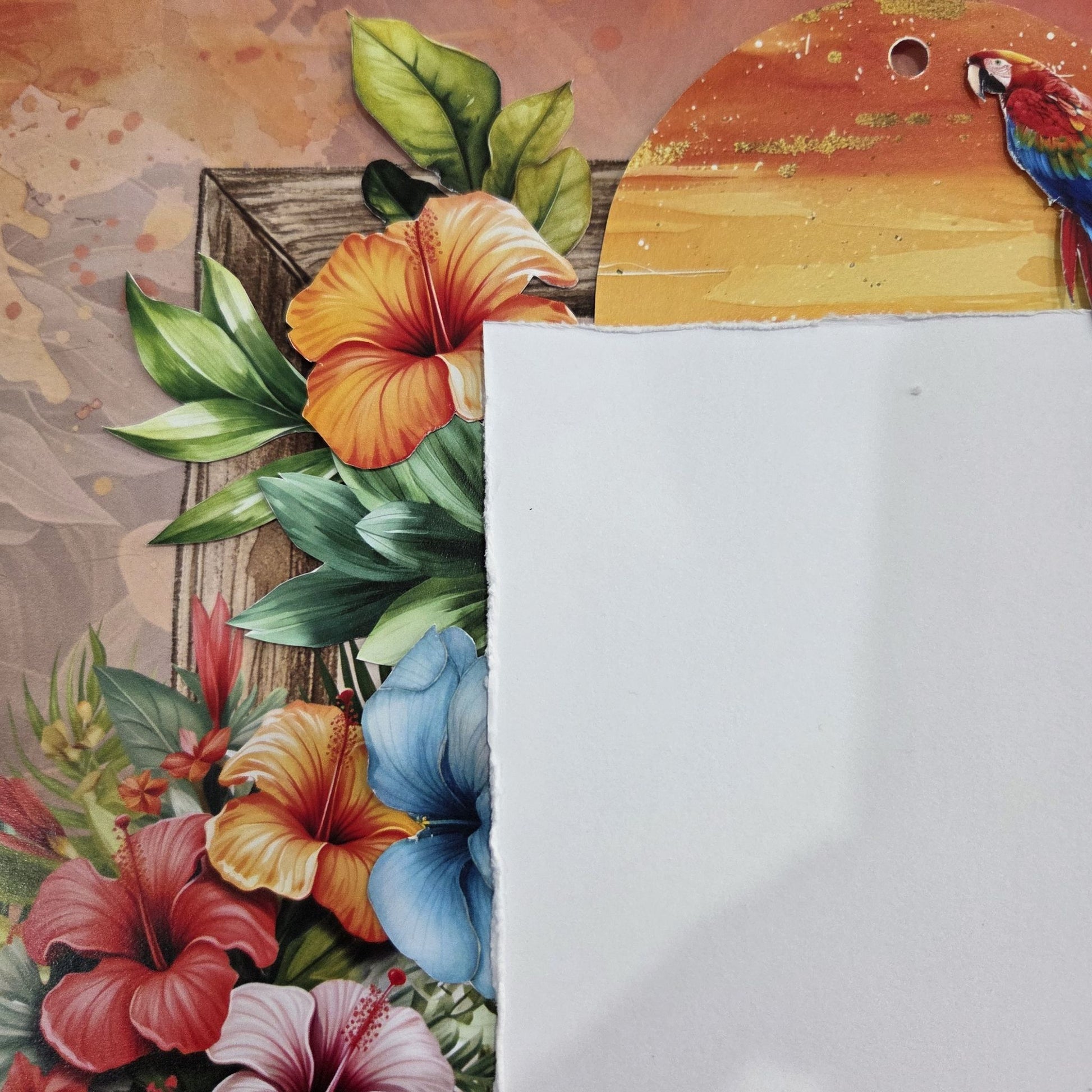 Detail of Tropical Excursion scrapbook layout showing layered hibiscus florals, parrot embellishment and sunset tag on warm terracotta background