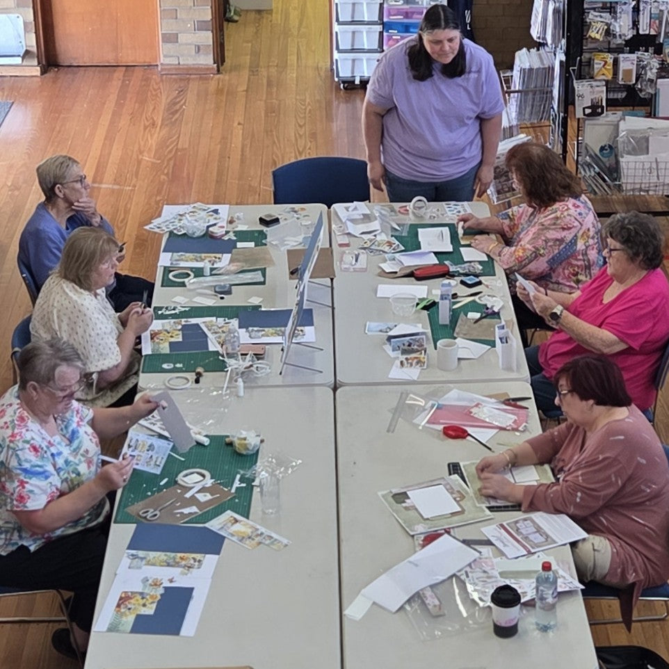 Julie teaching card making techniques to a class of crafters at Handmade Haven scrapbooking class in Morwell
