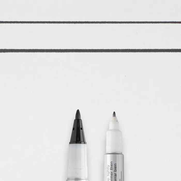 Close-up of the Sakura Identi Pen black marker showing its extra-fine and fine writing tips