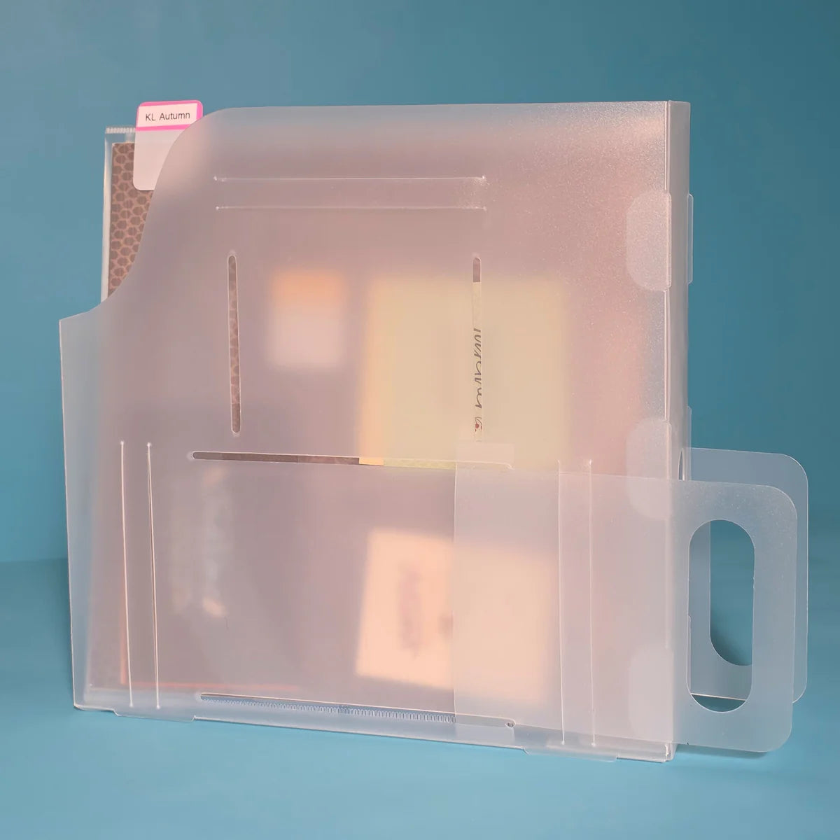 The Organized Option 12x12 Paper Handle-It in shelf-pull position loaded with 12x12 scrapbook paper and labelled with a tab sticker