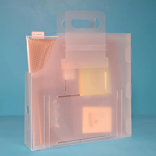 The Organized Option 12x12 Paper Handle-It in use, holding scrapbook paper and embellishments with label tab visible