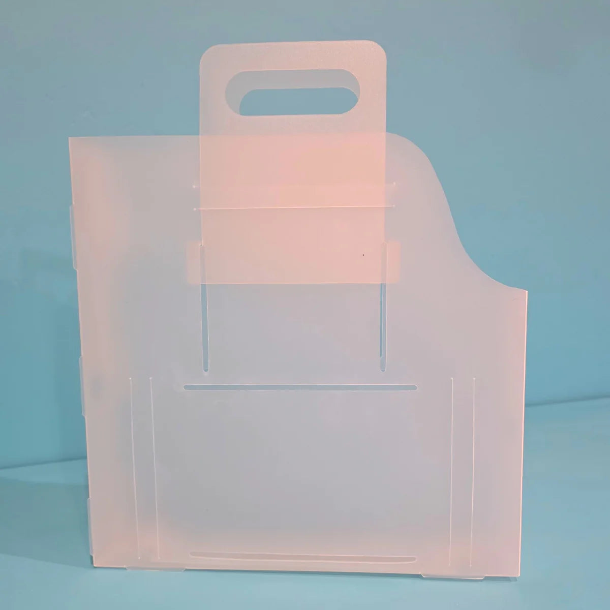 The Organized Option 12x12 Paper Handle-It upright with handles extended at the top for carrying