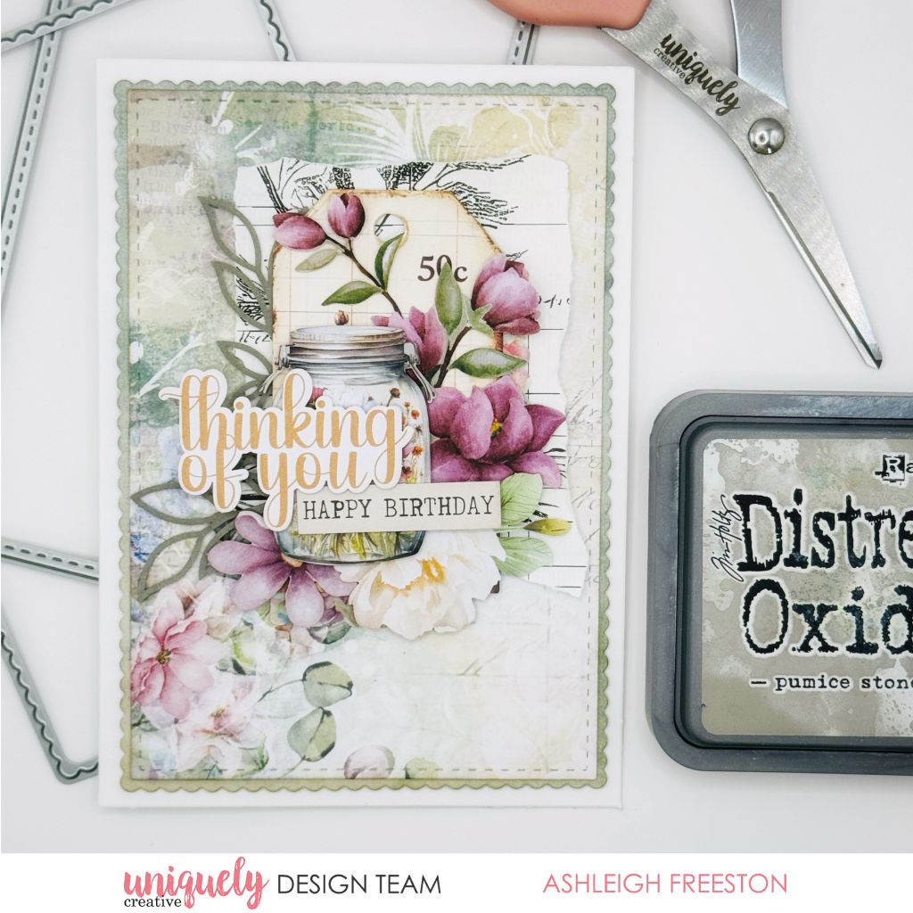 Handmade birthday card by Ashleigh Freeston using Uniquely Creative Botanical Chronicles collection – features pink and white florals, mason jar illustration, and sentiments “thinking of you” and “HAPPY BIRTHDAY.” Scalloped edge and vintage botanical background add charm to this soft, layered design.