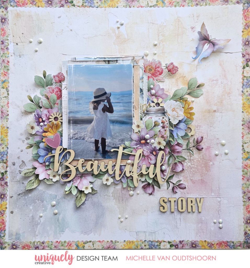 Scrapbook page by Michelle Van Oudtshoorn using Uniquely Creative Floral Archives collection – features a serene beach photo of a child in a white dress and sun hat, framed by pastel florals, pearl accents, and a butterfly. Sentiment “Beautiful STORY” anchors the soft, elegant design perfect for capturing heartfelt seaside memories.