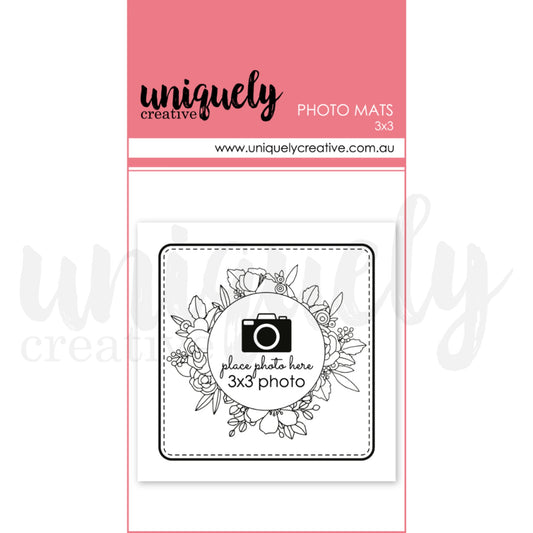 Uniquely Creative 3x3 photo mats pack showing white cardstock mat with floral wreath design and camera icon place holder for scrapbook layout planning 