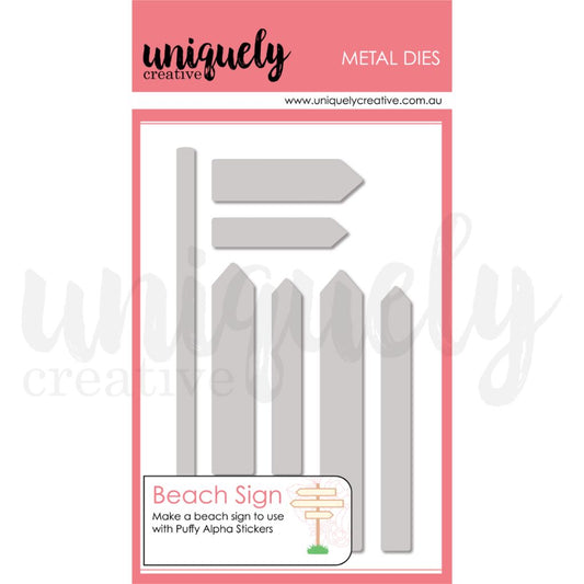 Uniquely Creative Beach Sign Metal Die Set showing 8 dies including signpost, grass base and six banner/slat pieces on pink branded packaging