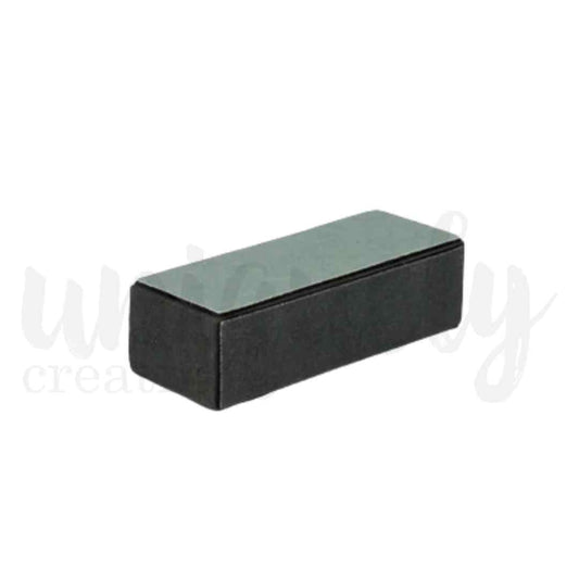 Uniquely Creative black rectangular sanding block with a grey abrasive surface 