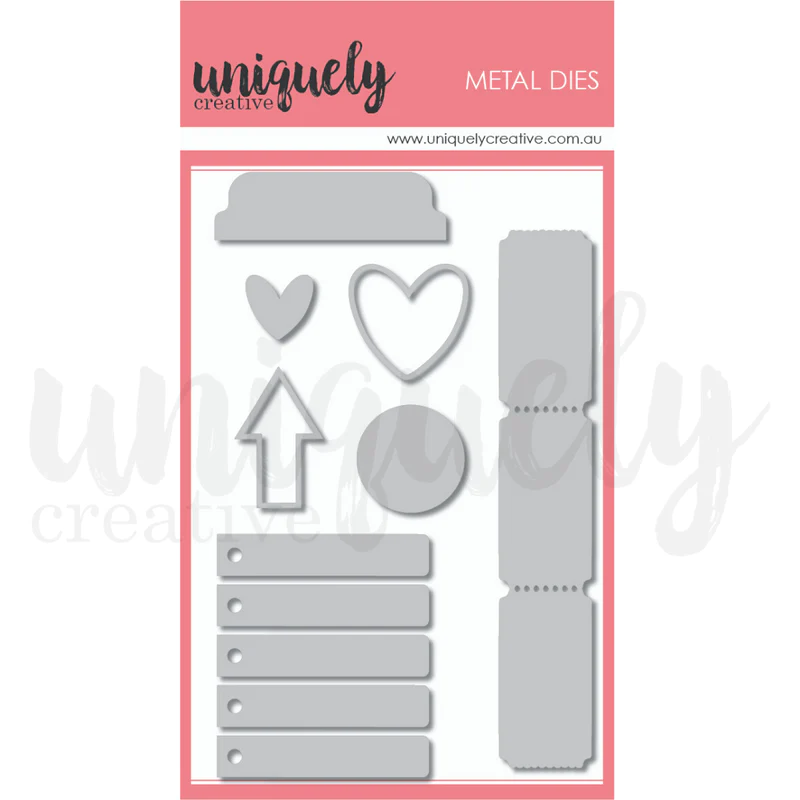 Uniquely Creative Cut-A-Part Essentials #2 Die showing 7 metal dies including scalloped tab, solid heart, outlined heart, arrow, circle, perforated ticket and 5 small tags with eyelets