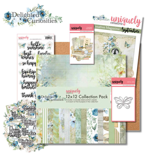Uniquely Creative Delighted Curiosities September Creative Kit contents showing the 12x12 Collection Pack, Sweet Sentiments sticker sheet, Creative Cuts, Vintage Canvas Elements, Delicate Butterfly Die, Cork Sheet, and Creative Magazine
