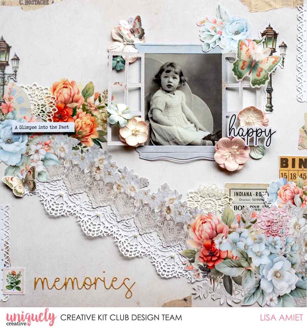 Vintage-style scrapbook layout with a black-and-white childhood portrait, dusty pink flowers, butterflies and layered floral embellishments