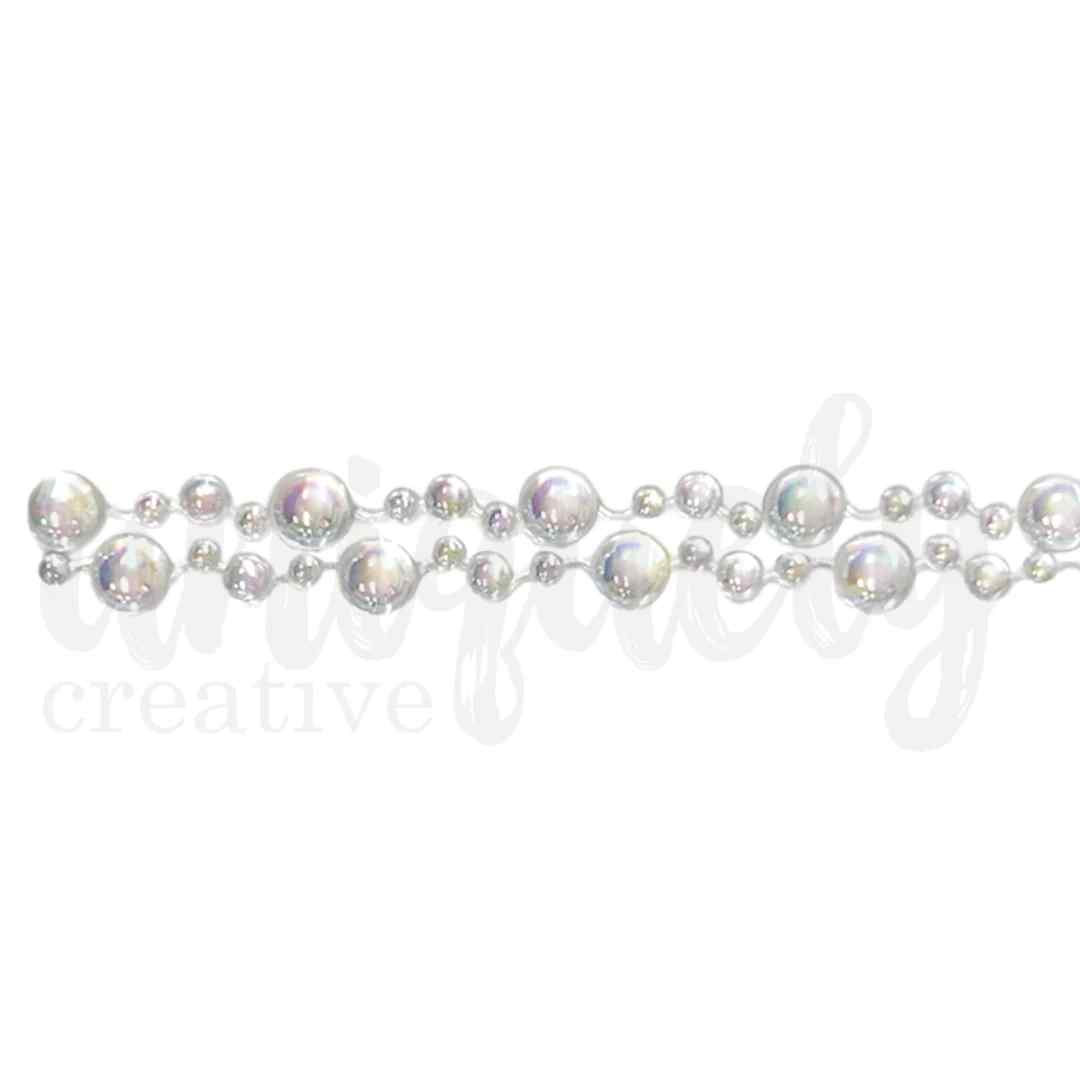 Close-up of Chantilly Pearl Tape with two staggered rows of mixed-size iridescent pearl embellishments