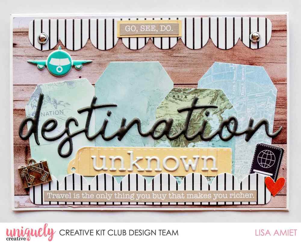 Travel-themed destination unknown card with silver pearl accents, layered tags, striped scalloped borders and an aeroplane embellishment