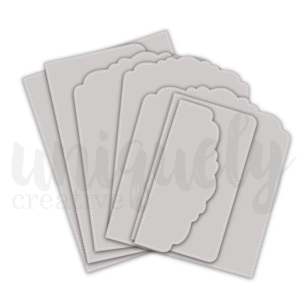 Seven die-cut stitched panel shapes from the Uniquely Creative 6x8 Flip Folio Album Die Set