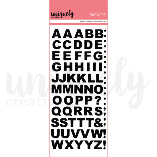Uniquely Creative Black Glitter Alpha Stickers packaging showing uppercase A–Z bold glitter letter stickers approx. ½" for scrapbooking and card making