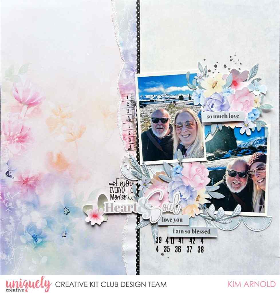 Scrapbook layout sample featuring two travel photographs, pastel floral embellishments, Heart & Soul lettering, and “So much love” and “I am so blessed” labels.