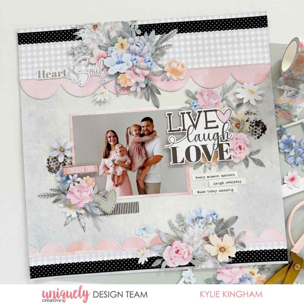 Scrapbook layout sample with a family photo, floral embellishments, pink scalloped borders, black polka-dot strips and “Live Laugh Love” lettering.
