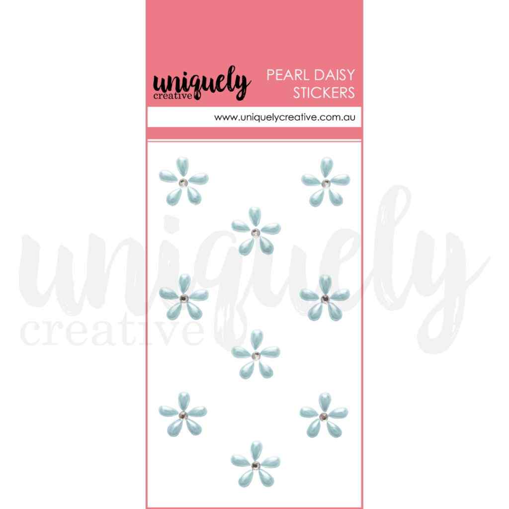 Uniquely Creative Pearl Daisy Stickers in blue, showing nine small pale-blue five-petal flower stickers with rhinestone centres on a white card with a pink header.