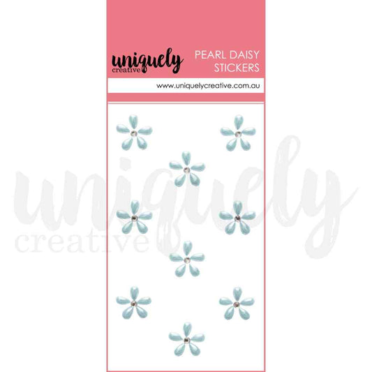 Uniquely Creative Pearl Daisy Stickers in blue, showing nine small pale-blue five-petal flower stickers with rhinestone centres on a white card with a pink header.