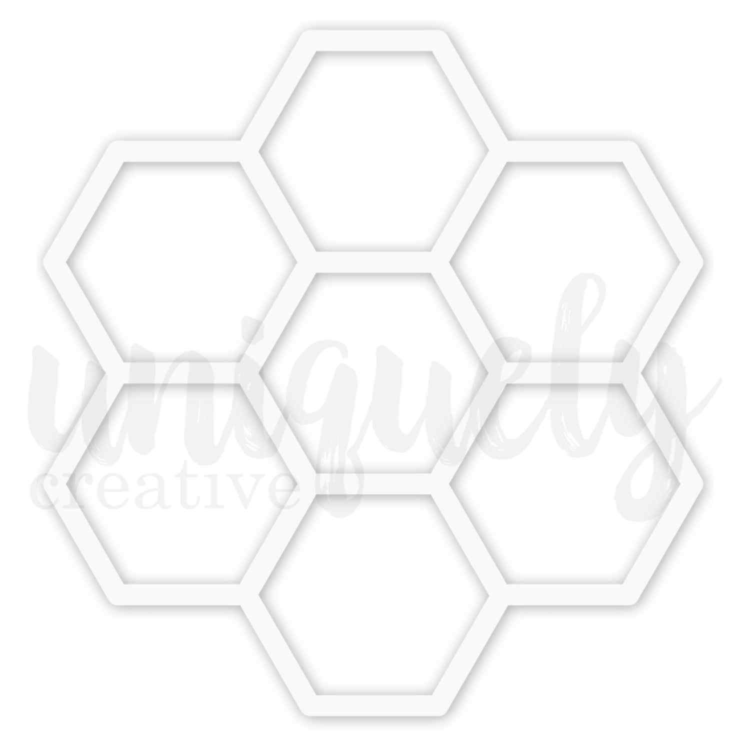 Uniquely Creative Honeycomb Overlay approximately 8x8 inch white chipboard overlay featuring seven large open hexagons arranged in a honeycomb cluster shape 