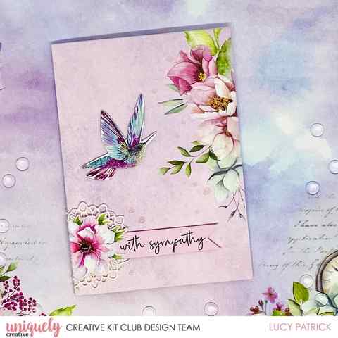 Handmade sympathy card with a hummingbird, watercolour florals and a lace doily accent