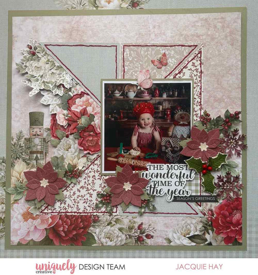 Scrapbook layout using the Christmas Keepsakes collection featuring red poinsettias made with the die. 