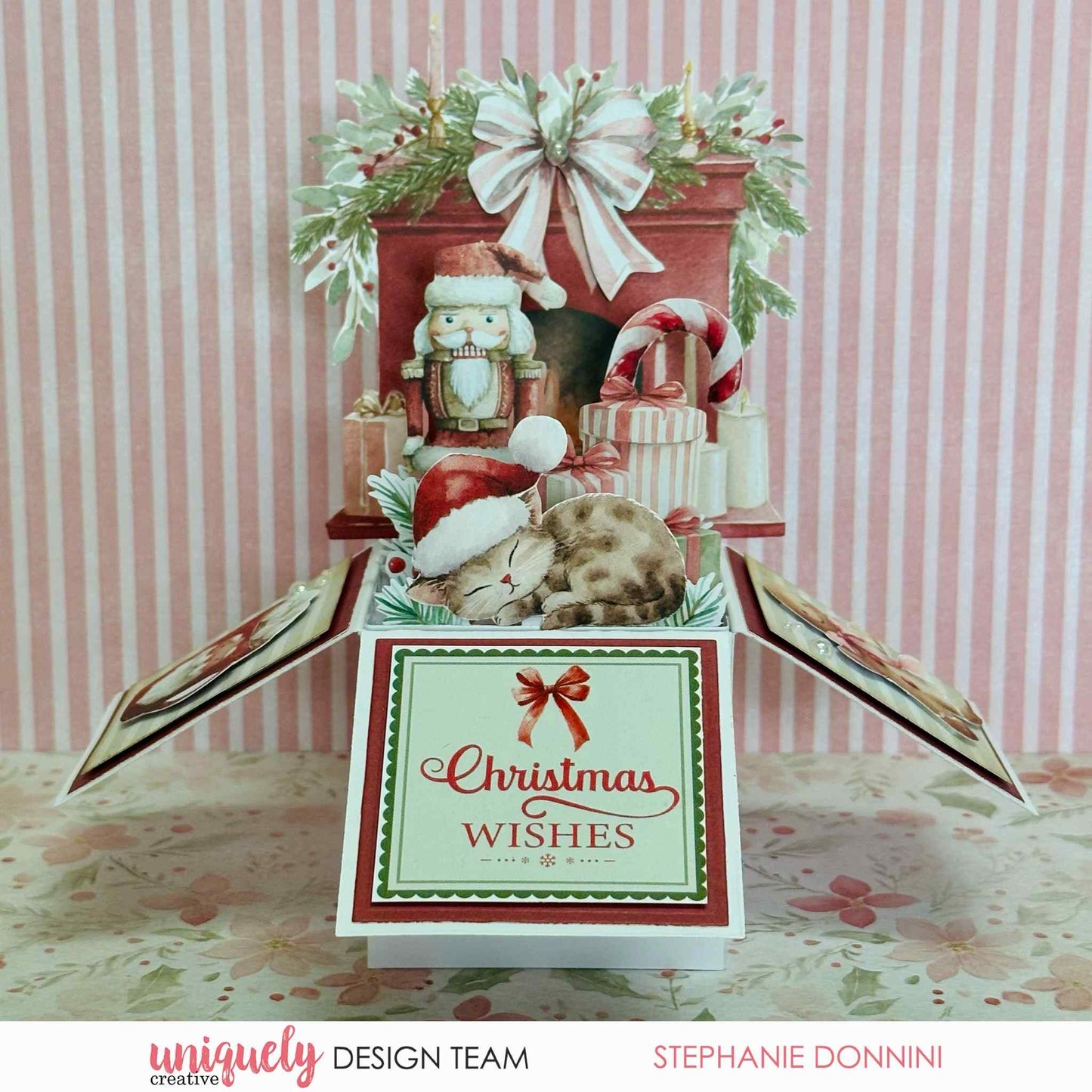 Handmade Christmas box card featuring Uniquely Creative Little Festive Things creative cuts with a nutcracker, sleeping cat in a Santa hat, fireplace, and Christmas Wishes sentiment in traditional red and green tones 