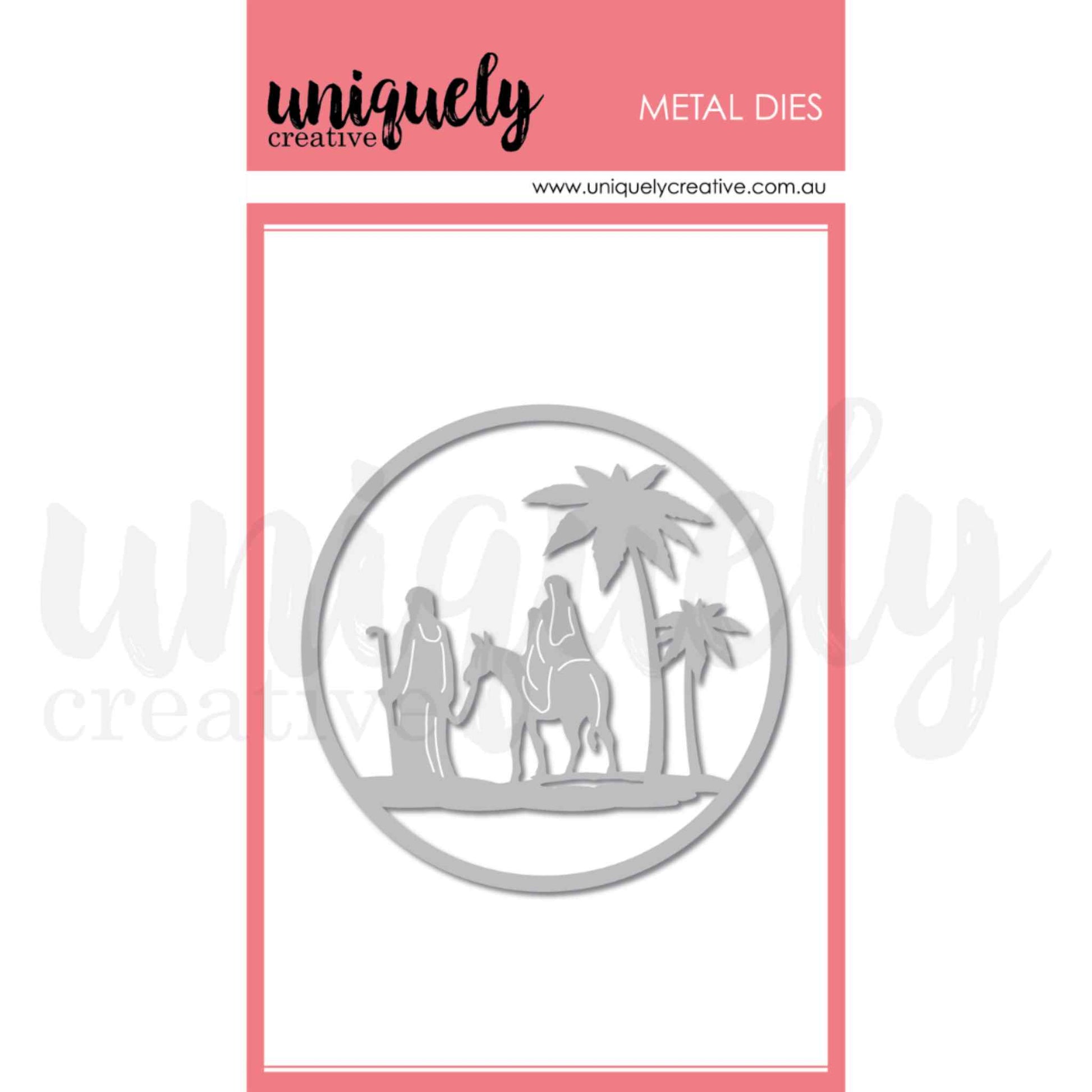 Uniquely Creative Nativity Scene Die, a single metal cutting die featuring a circular framed silhouette of Mary riding a donkey led by Joseph with two palm trees, approximately 3½" × 3½"