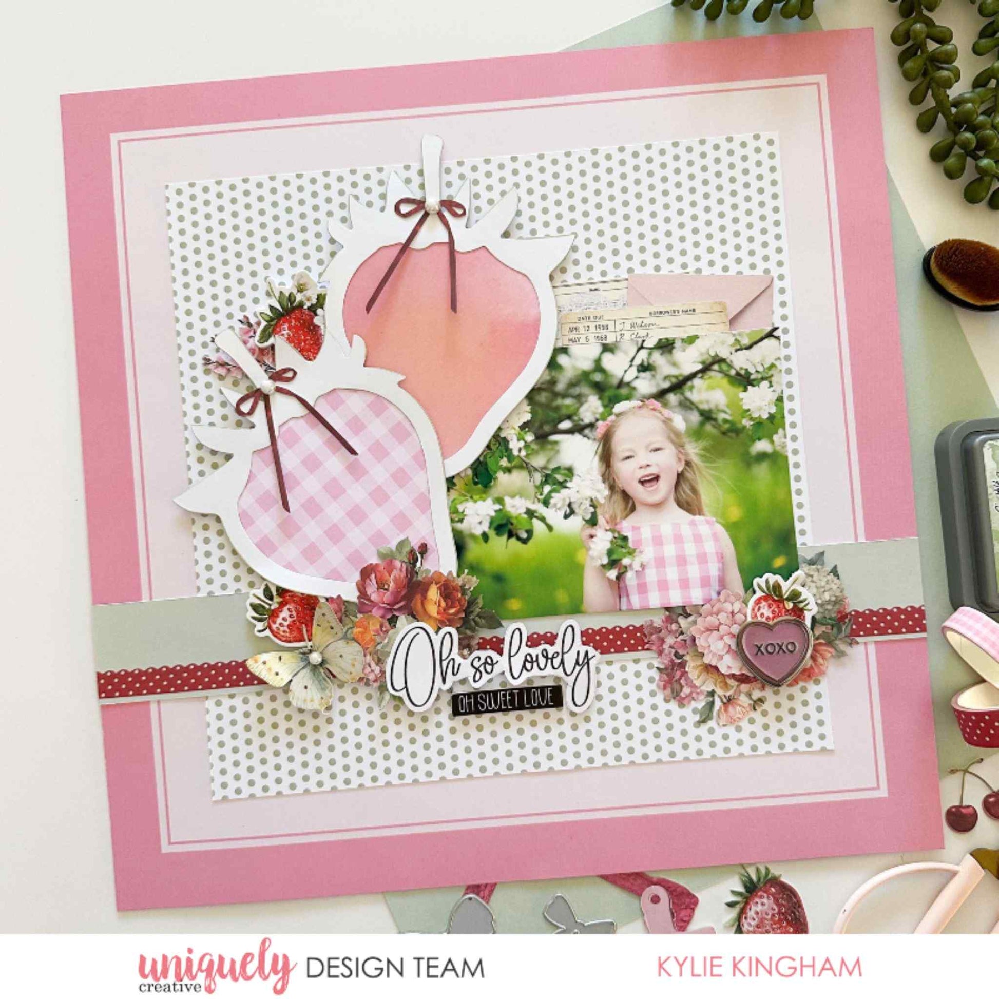 Scrapbook layout using Uniquely Creative Oh So Lovely collection featuring a strawberry shaped overlay, gingham and polka dot papers, floral cluster and Oh So Lovely sentiment with a child's photo by Kylie Kingham