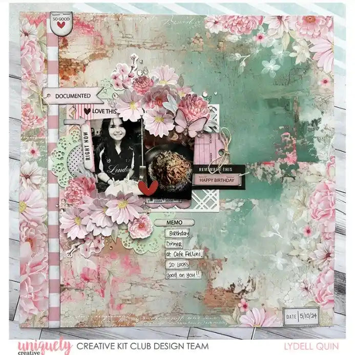 Scrapbook page using a pastel paper doily as a decorative layer beneath photos and paper craft embellishments