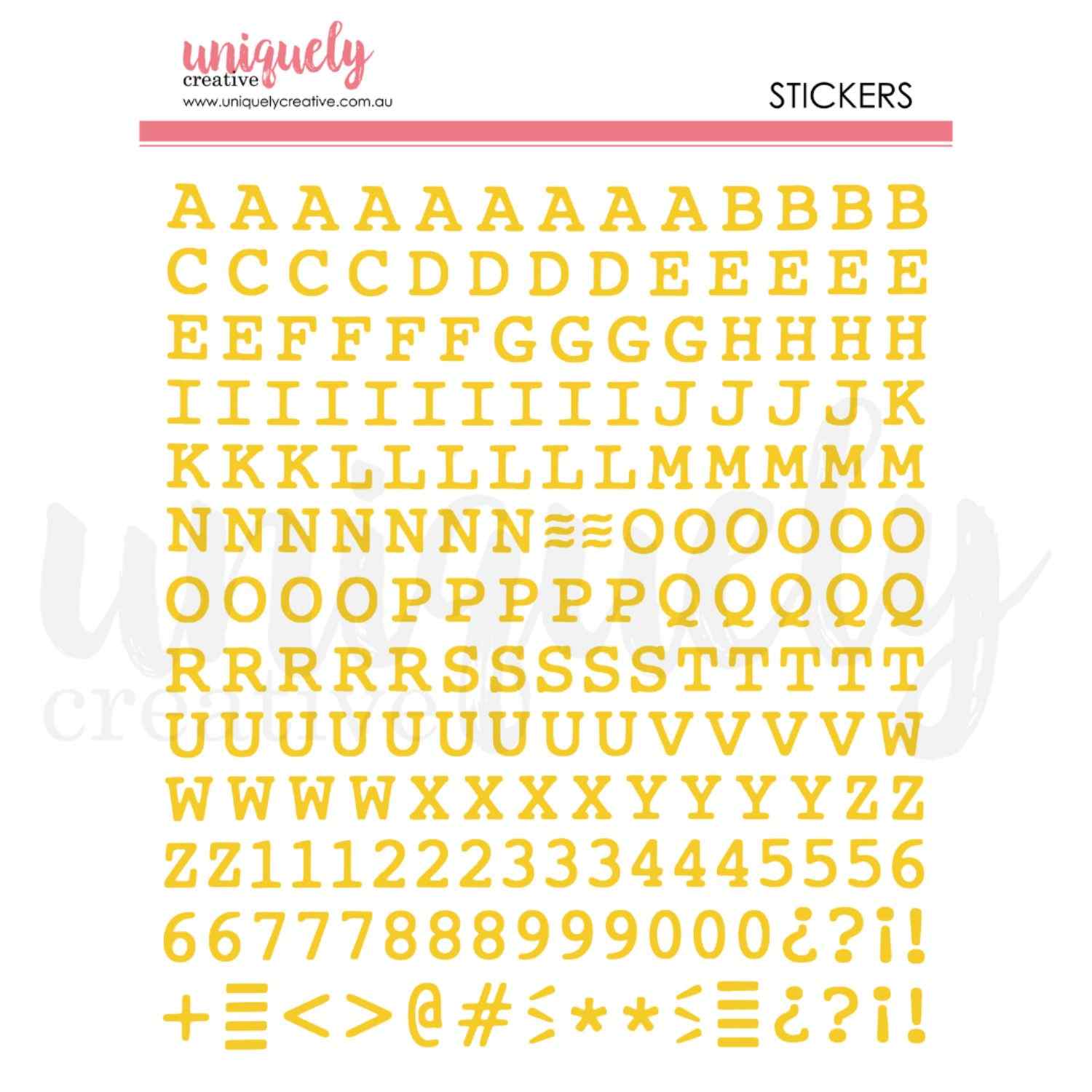 Uniquely Creative Puffy Alpha Stickers Uppercase Gold sticker sheet showing a full uppercase alphabet A–Z, numbers 0–9, and punctuation and symbol characters in warm golden yellow, approximately 1/2" size 