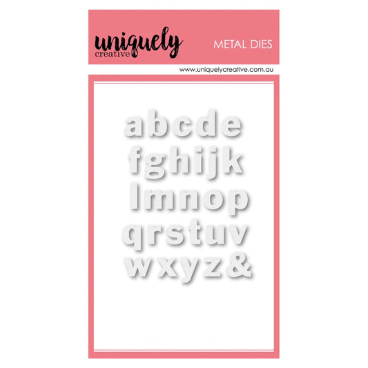 Uniquely Creative Small Lowercase Alphabet Metal Die showing complete a-z alphabet and ampersand in white dimensional letters on pink branded packaging