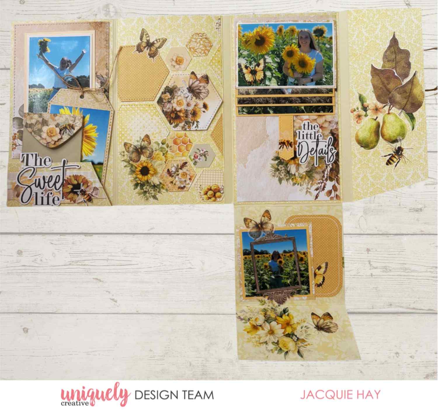 Uniquely Creative Sweet As Honey scrapbook album sample showing fold-out layout with sunflower photos, honeycomb hexagon panels, butterfly and bee embellishments, and "The Sweet Life" title