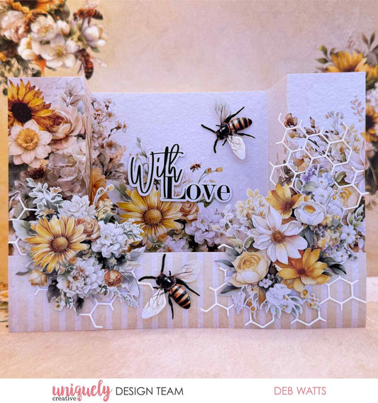 Uniquely Creative Sweet As Honey gatefold card with "With Love" sentiment, layered sunflowers, daisies, roses, honeycomb die cuts, and bee embellishments, created by Deb Watts