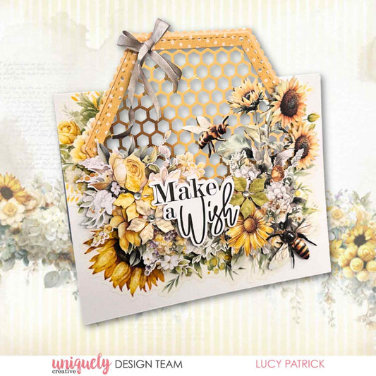 Uniquely Creative Sweet As Honey hexagon envelope-shaped card with "Make a Wish" sentiment, sunflowers, bees, and honeycomb die cut panel with ribbon bow, created by Lucy Patrick