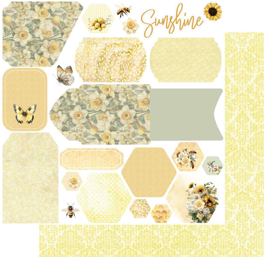 Uniquely Creative Sweet As Honey Picked Flowers 12x12 paper stack showing front and reverse sides, featuring a cut-apart sheet of die-cut shapes, tags, hexagons, and ephemera elements on white, with a soft yellow tonal damask reverse
