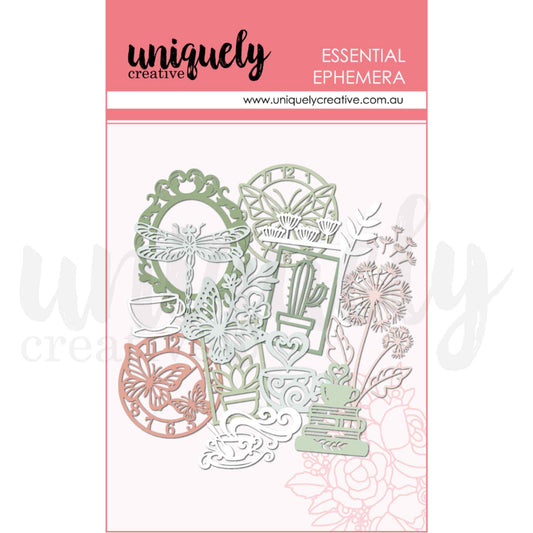 Bloom and Brew Essential Ephemera by Uniquely Creative — pre-cut cardstock shapes including ornate mirror frame, dragonfly, butterfly clock, teacup, cactus frame, dandelions, and botanical sprigs in sage green and blush pink